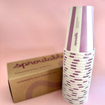 Stack of 22 Sproutable mauve striped 12oz home compostable cups next to branded box – plant fiber, home compostable, plastic-free